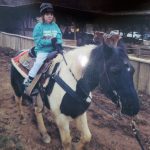 Boy riding a horse