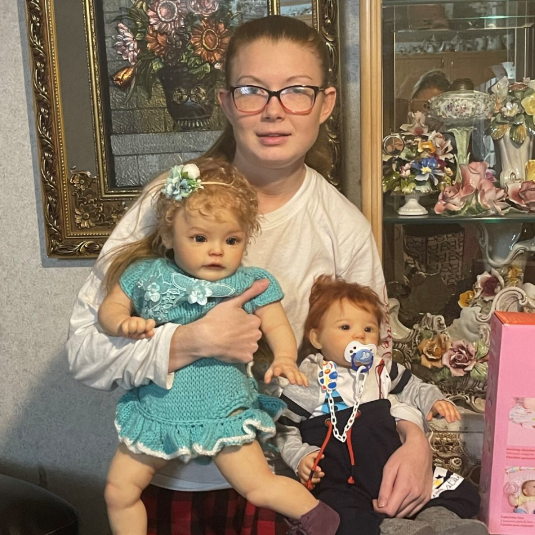 Girl with intellectual disability holding her new real baby dolls