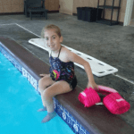 Rebekah with spina bifida having fun at the pool during her vacation in Lancaster