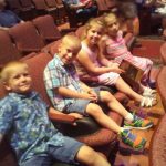 Rebekah with spina bifida and her siblings at a theater in Lancaster