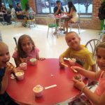 Rebekah and her siblings eating ice cream at the Turkey Hill Experience