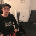 Teen boy with PS5 console