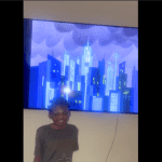 Marquise with autism in front of his new TV