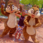 Akirij with autism meeting Chip and Dale in Disney World