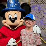 Angelo with Mickey Mouse in Disney World