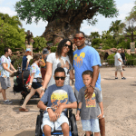 Cameron with cerebral palsy in front of the Tree of Life at Animal Kingdom
