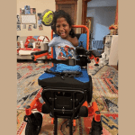 Child, no limbs, gets new wheelchair