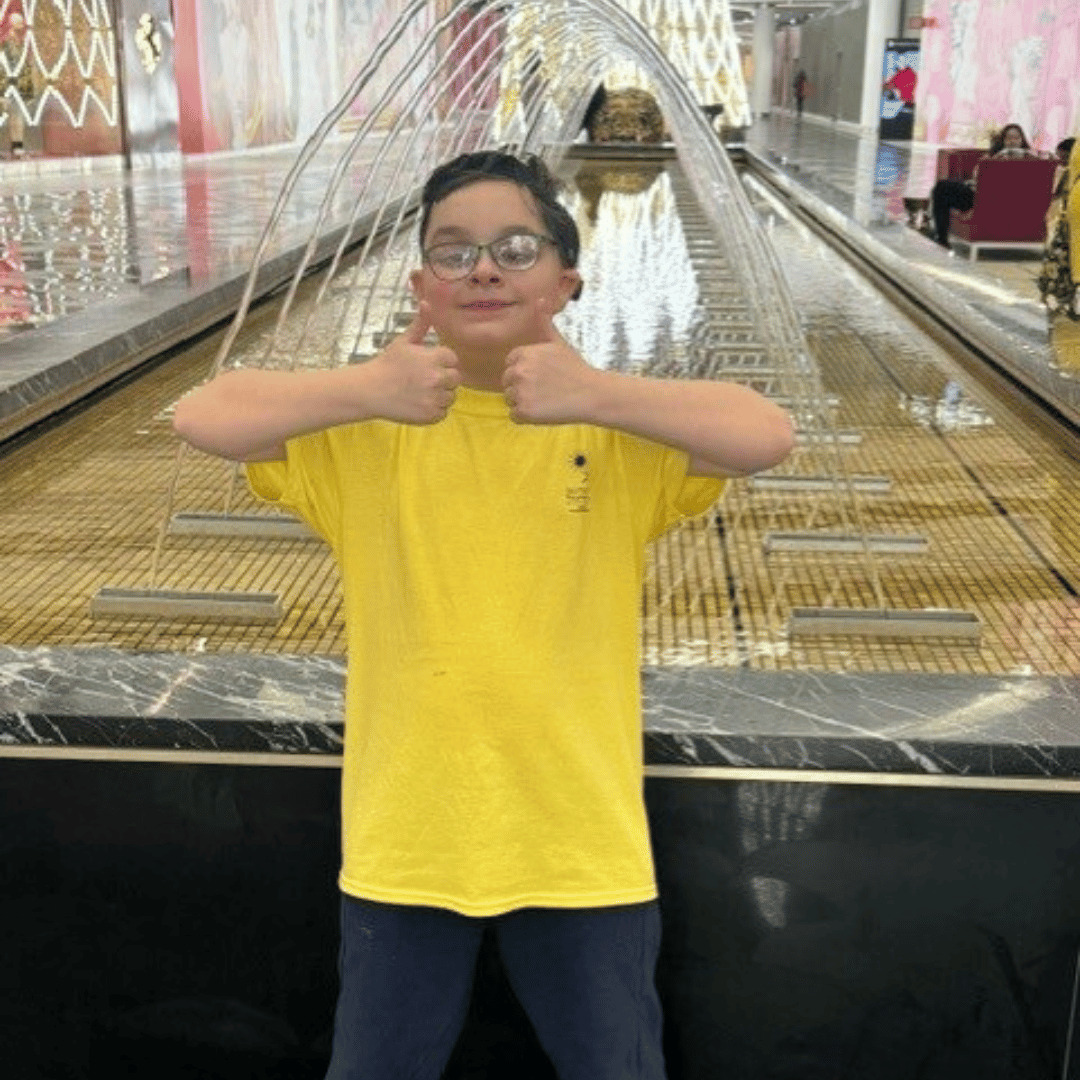 Boy with bilateral hearing loss enjoys a dream trip to American Mall to enjoy the indoor waterparks and other ammenities.