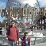 Nicholas with cerebral palsy in front of the Universal Studios fountain