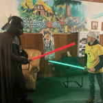 Teenage boy with epilepsy dueling Darth Vader at the Dream Village