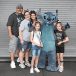 Girl with cerebral palsy with Stitch in Disney