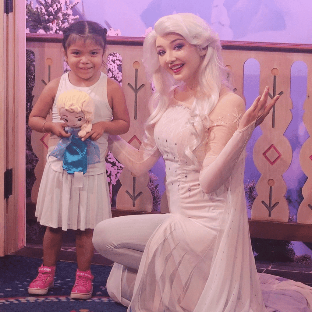 Myla with level 3 severe autism spending time with Elsa in Epcot
